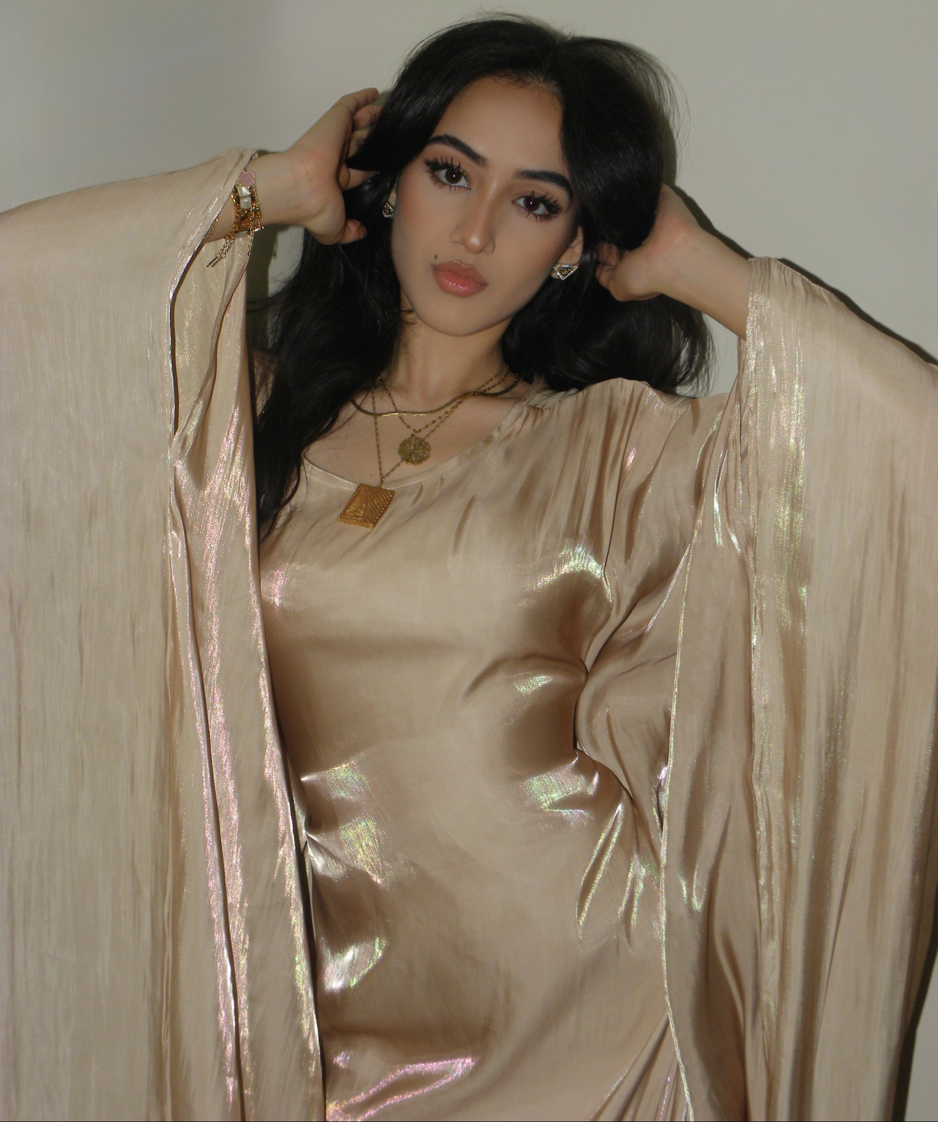 gold abaya dress Gold Abaya Golden Abaya with bishop sleeves and feather trimmings. Comes with a dress and headscarf. Abayas from Almahra Atelier at Boksha